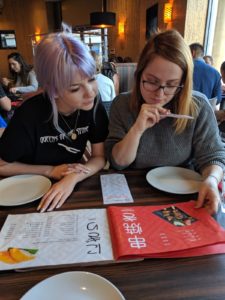 Sushi decisions looking at the menu